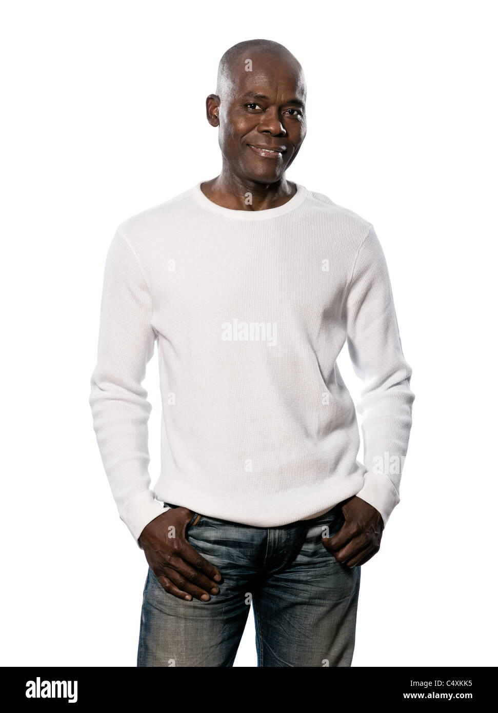 Portrait of a happy casual afro American man standing with hands in pocket in studio on white isolated background Stock Photo
