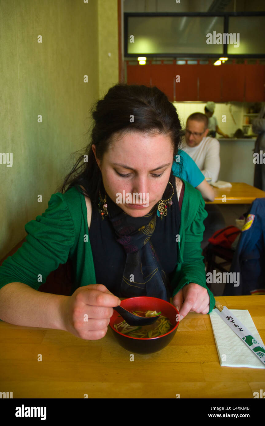 Woman in her 20s having soup Asian restaurant interior Linka Wienzelle street Vienna Austria central Europe Stock Photo