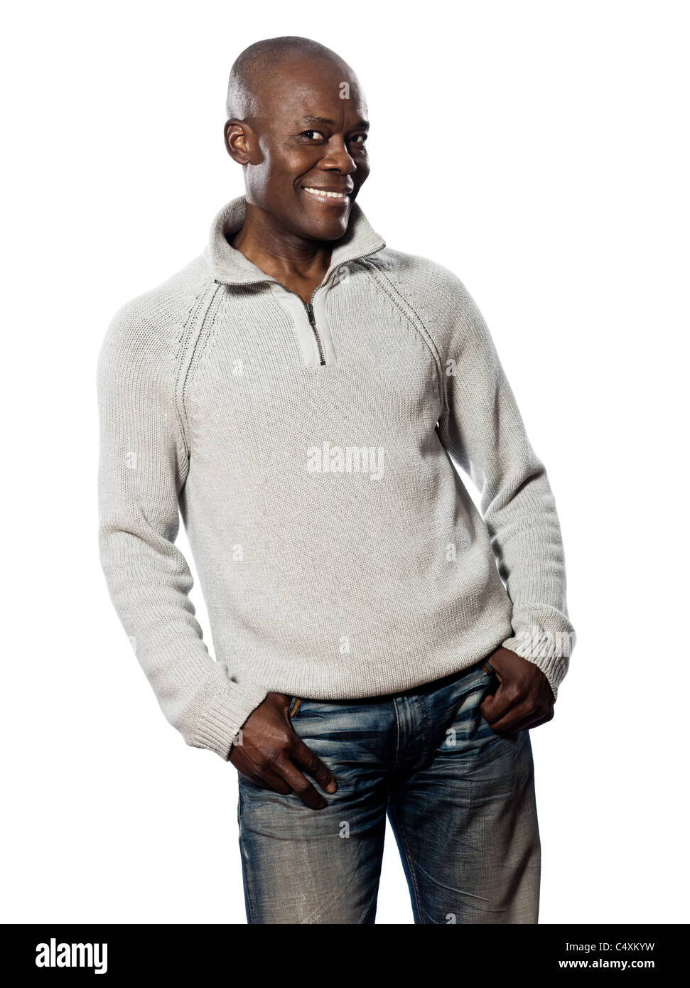 Casual mature afro American man standing smiling in studio with hands in pocket on isolated white background Stock Photo