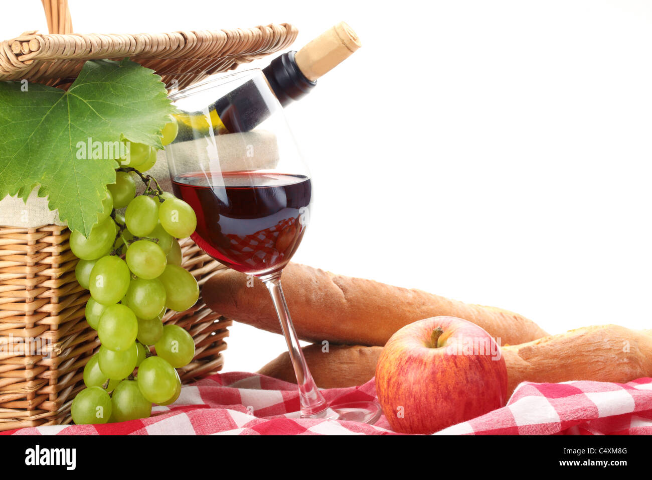 picnic basket with fruit bread and wine. Stock Photo