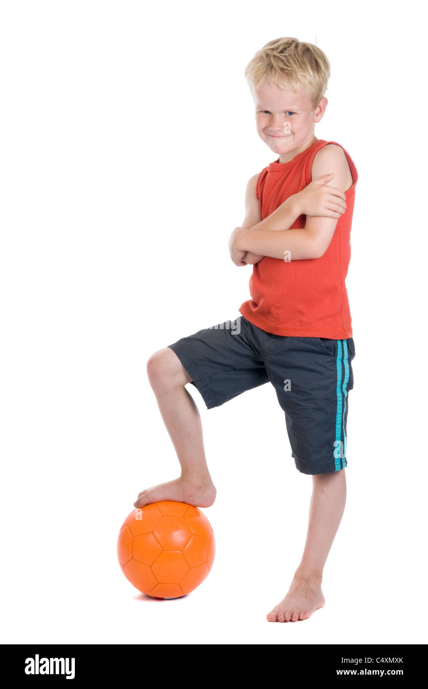 Boy with a football, against a white background. Stock Photo