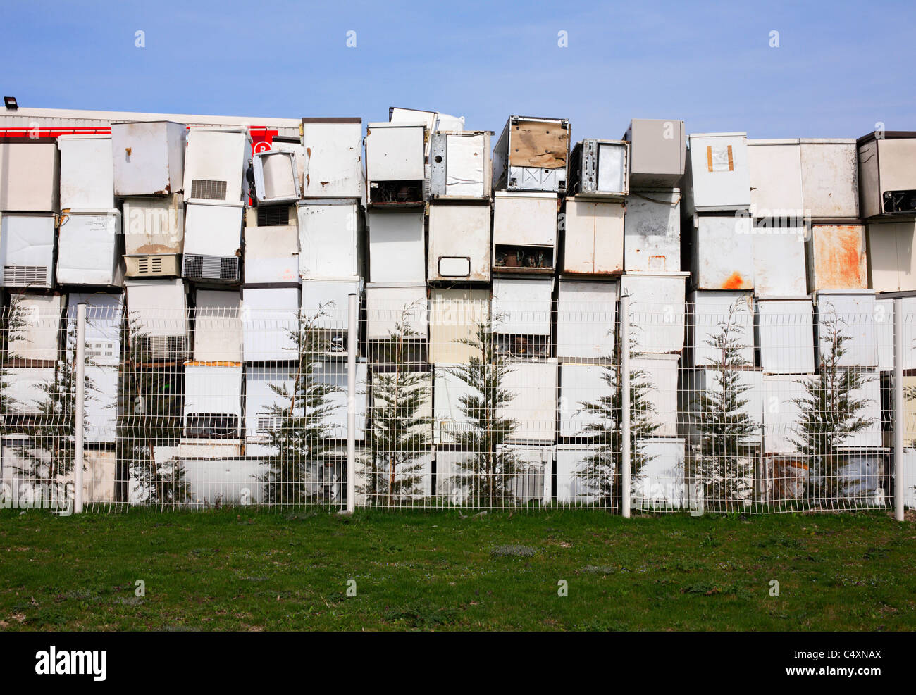Old fridges waiting to be scrapped and recycled. Stock Photo