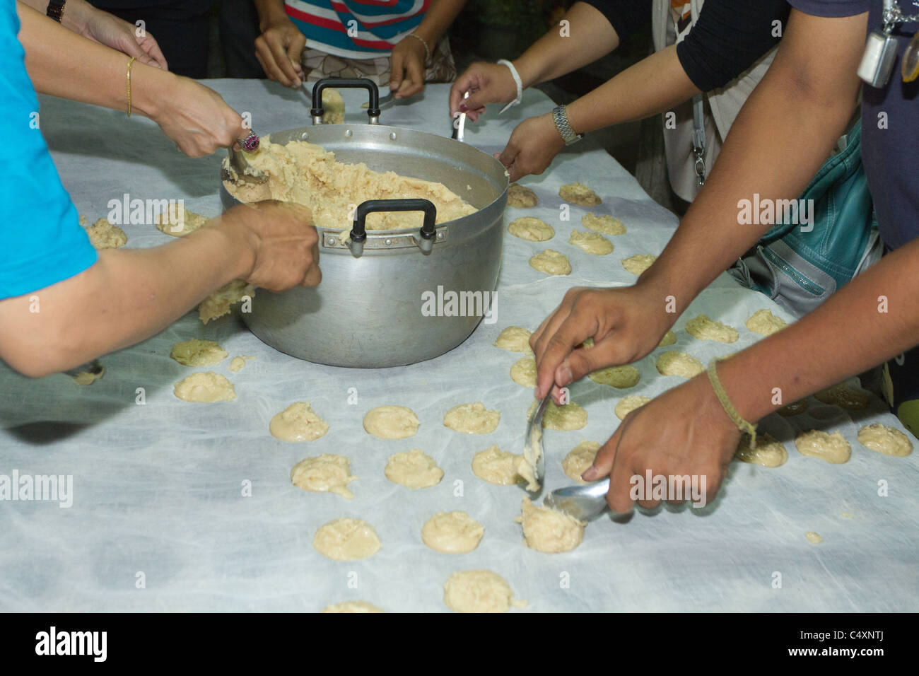 Production of thai palm sugar in a home factory, amphawa floating