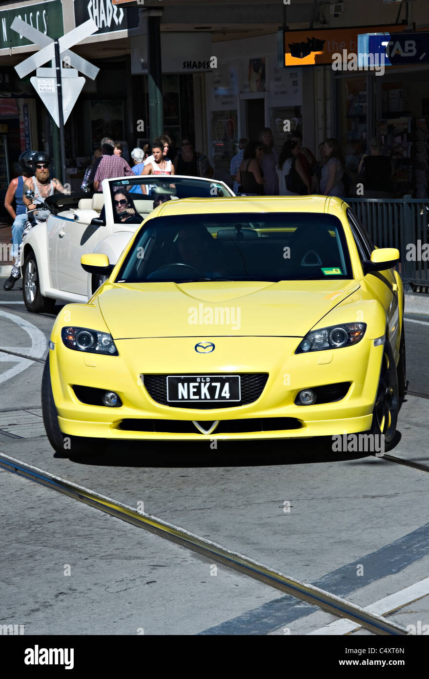Bright Yellow Mazda RX8 Sports Car and Volkswagen Beetle in Adelaide Suburb Glenelg South Australia SA Stock Photo