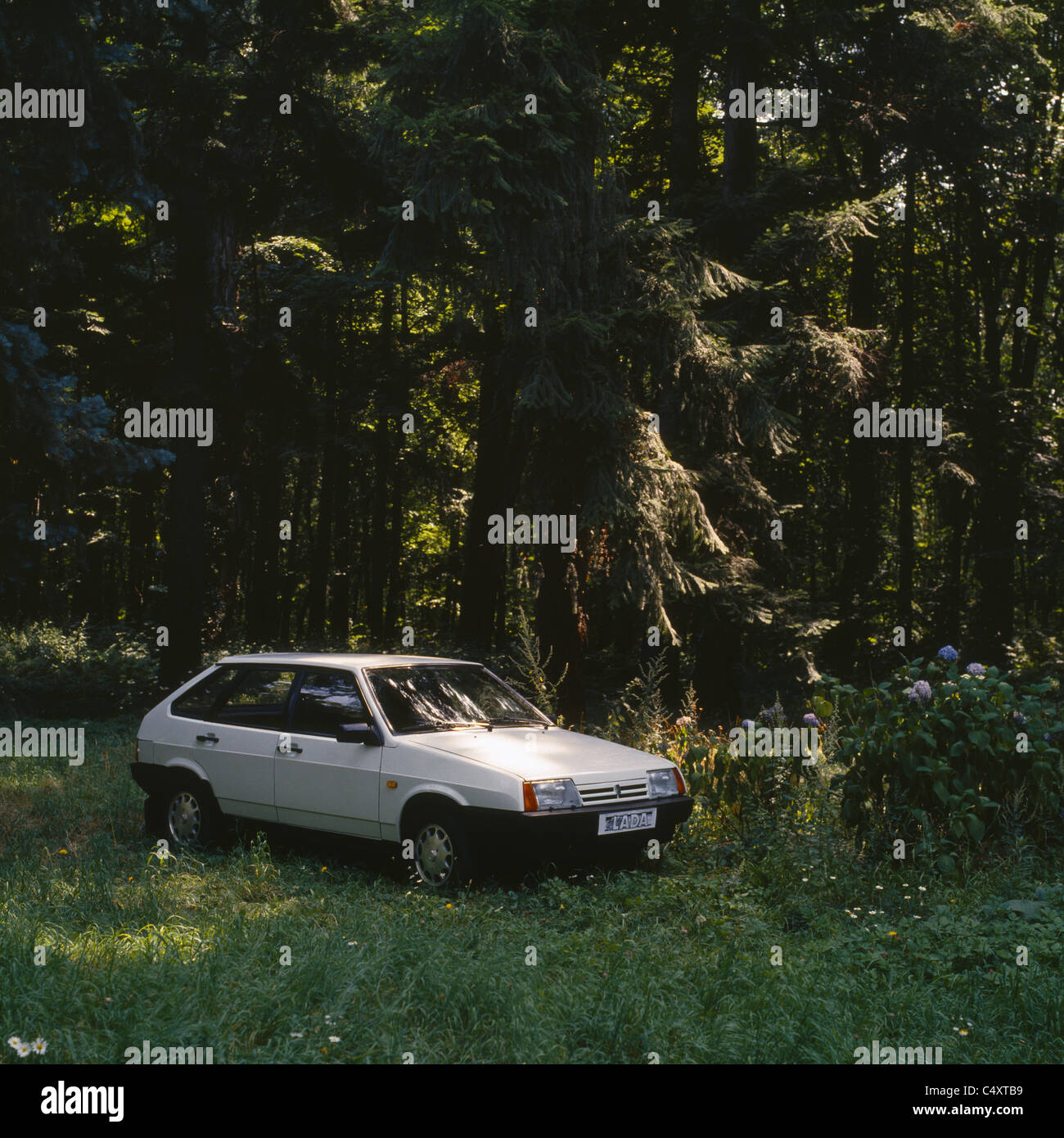 A new Russian Lada Samara car, parked at green forest, Bulgaria, Eastern Europe Stock Photo