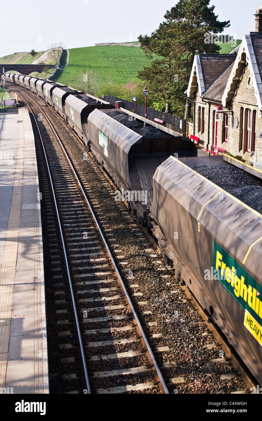 Freight Liner Wagons  Transporting Coal by British Railways  Coal Hoppers & Goods train at Tebay Station, Settle Carlisle, Cumbria, UK Stock Photo