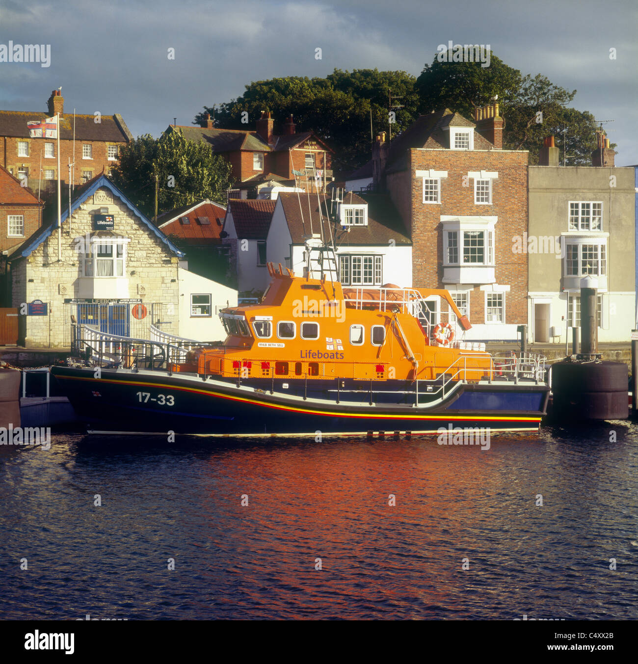 The Royal National Lifeboat Institution's Severn class lifeboat at the lifeboat station on Nothe Quay in Weymouth harbour Stock Photo