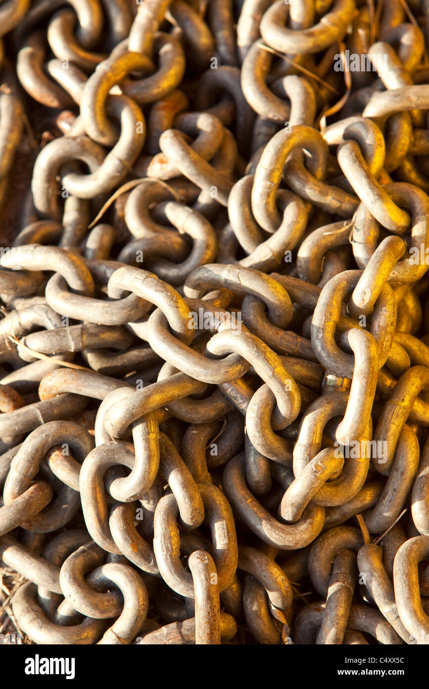Close up of large metal chain links. Huge oval shaped metal links with two  separate holes. Gray with brown rusty patches Stock Photo - Alamy