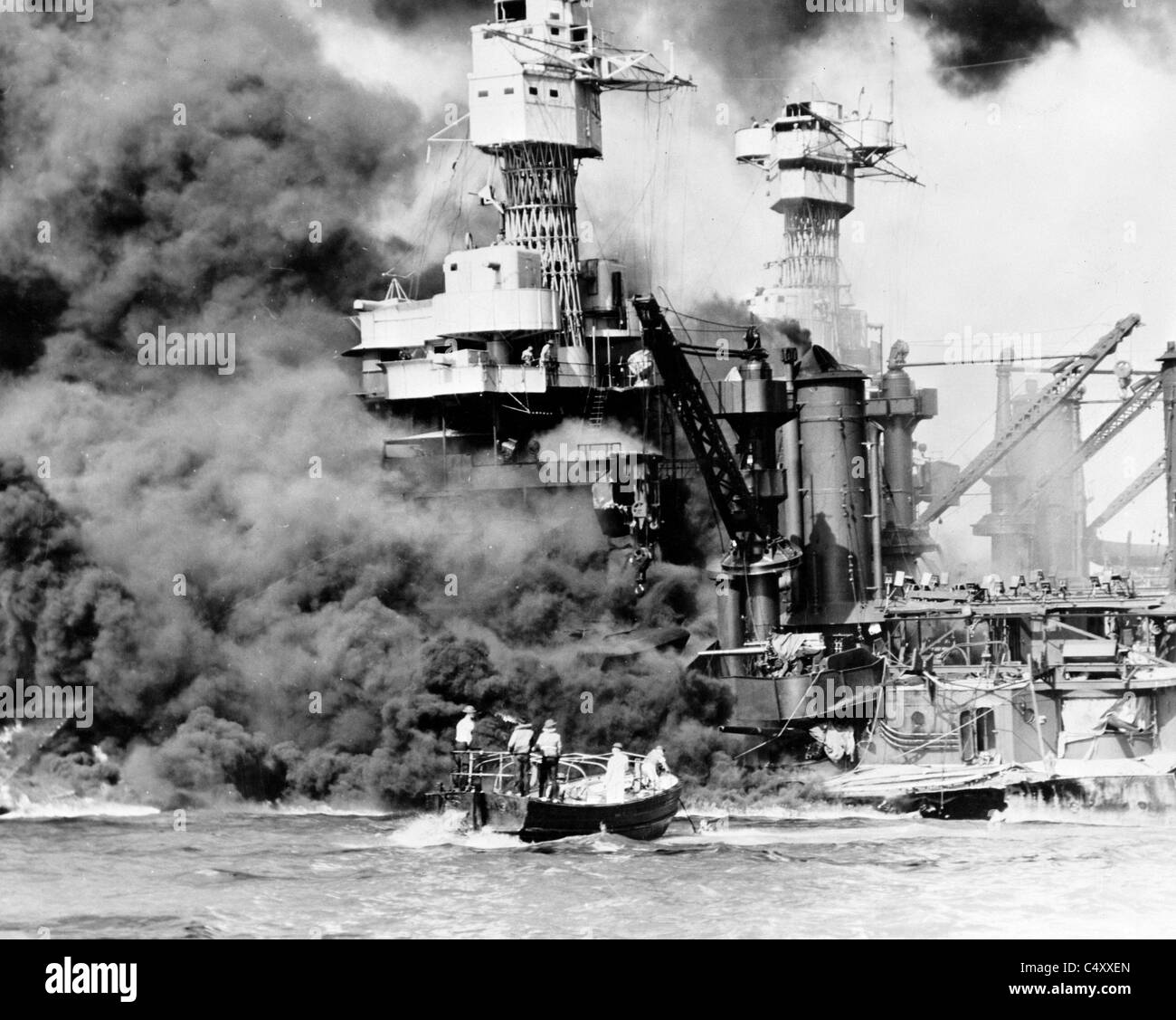 USS West Virginia burning after the attack on at Pearl Harbor, Hawaii. Stock Photo