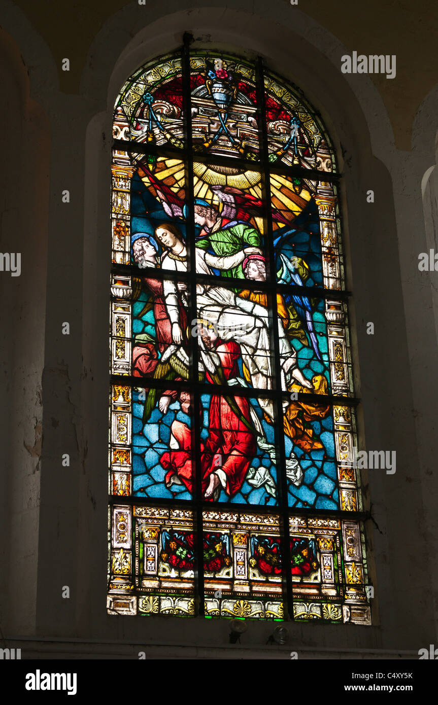Red Angel Stained glass window in St.George's Anglican Church, Kingstown, St. Vincent & The Grenadines. Stock Photo