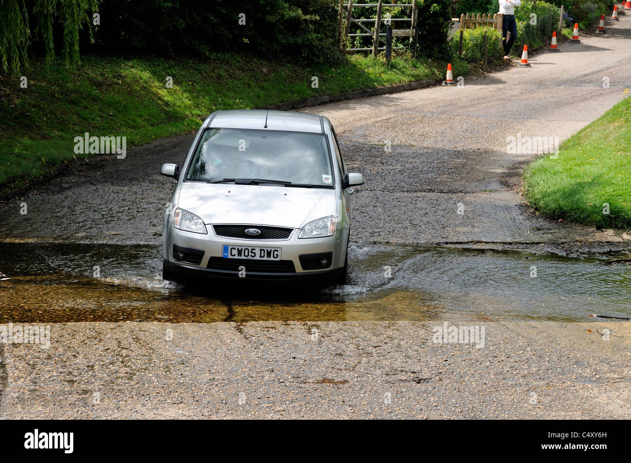 Car crossing ford at Braughing Village Hertfordshire England UK Stock