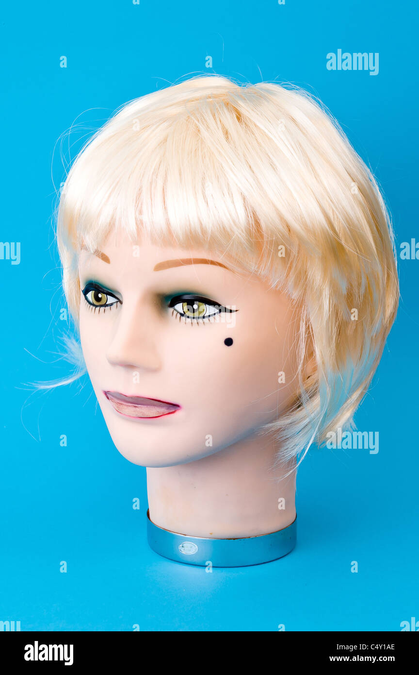 Dummy mannequin head wearing blonde wig Stock Photo Alamy