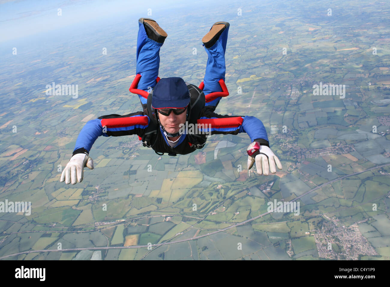 Closeup of skydiver in free-fall Stock Photo