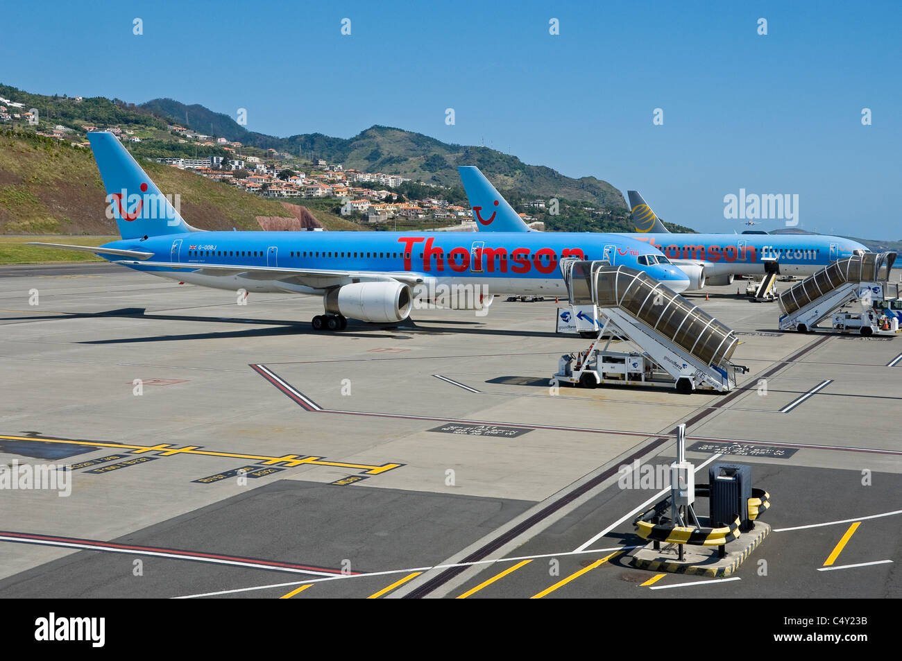 Thomson plane planes airplanes airplane aircraft parked at Funchal airport Madeira Portugal EU Europe Stock Photo