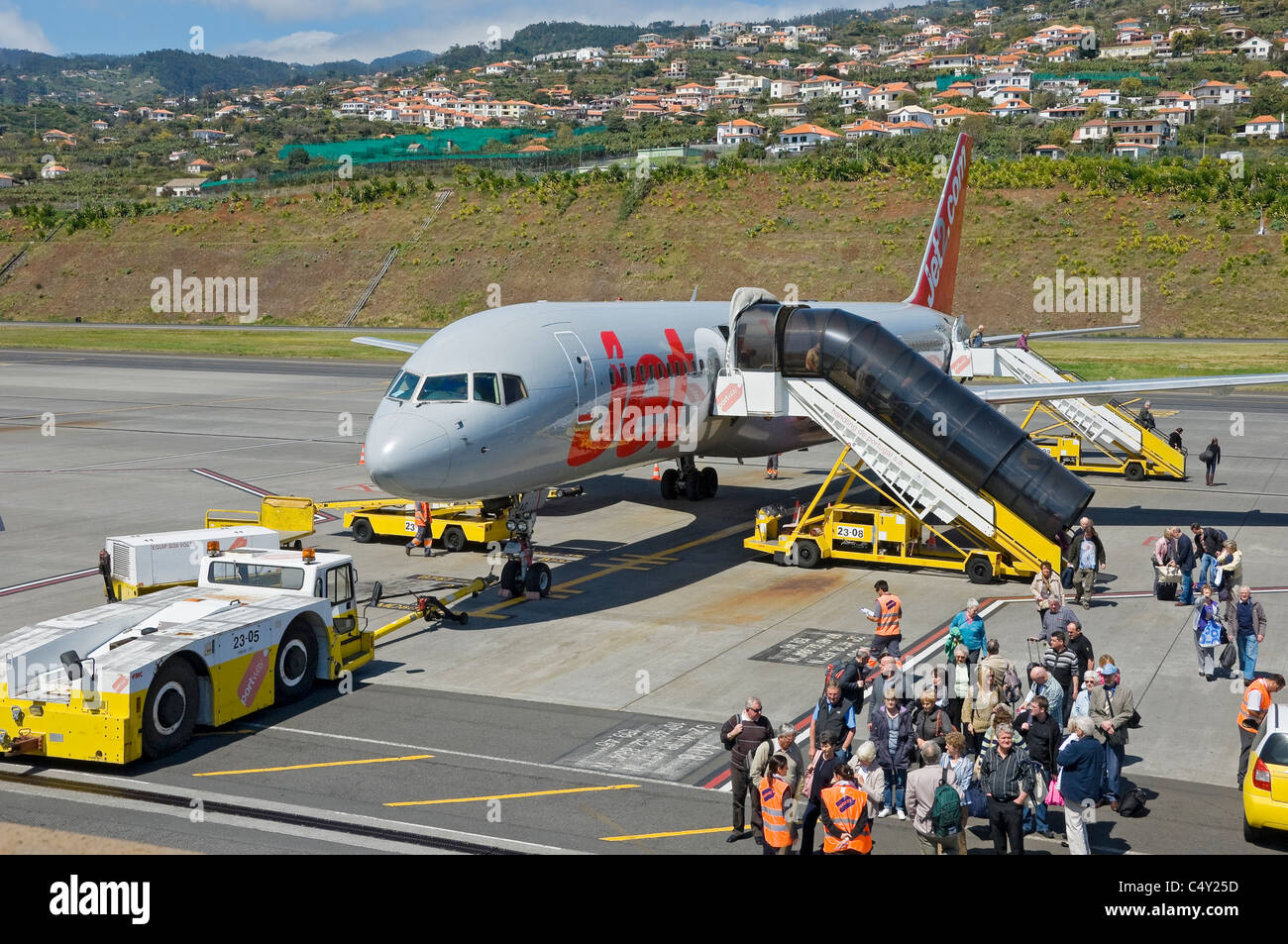 Passengers People tourists visitors leaving disembarking from Jet2 aircraft plane airplane at Funchal airport Madeira Portugal EU Europe Stock Photo