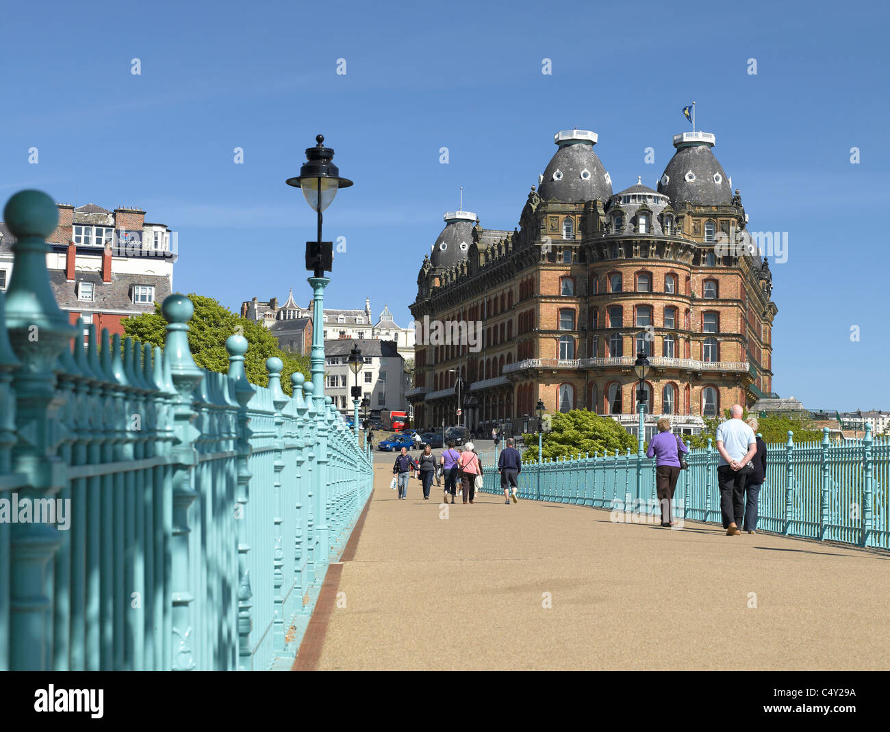 People tourists visitors walking across the Spa Bridge and the Grand Hotel South Bay Scarborough North Yorkshire England UK United Kingdom Britain Stock Photo