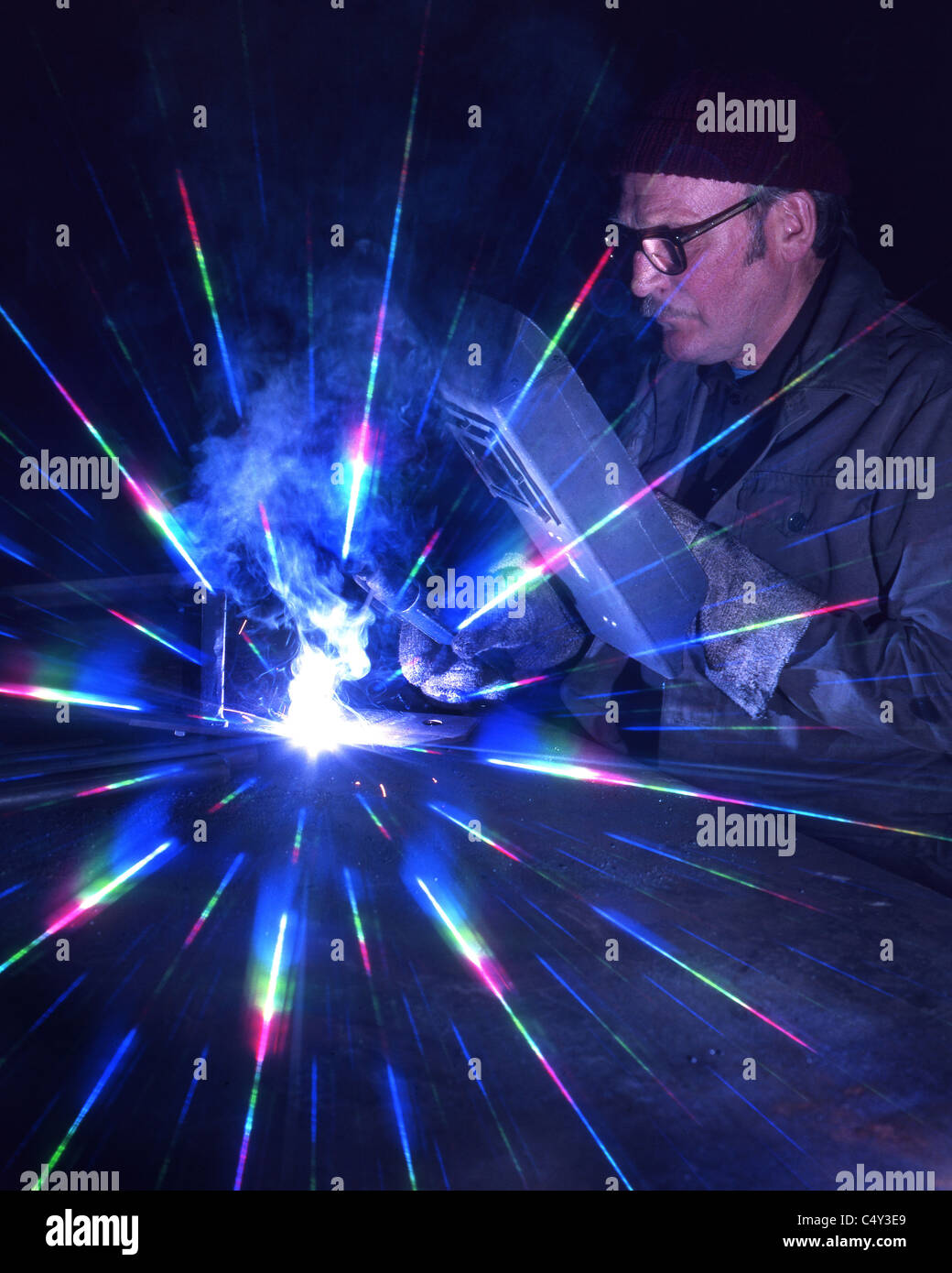 Electric arc welding with cosmos flare filter on camera lens Stock