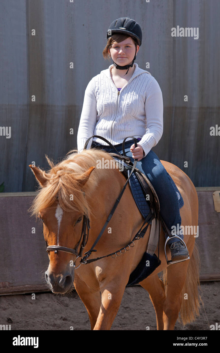 young girl learning to ride Stock Photo - Alamy