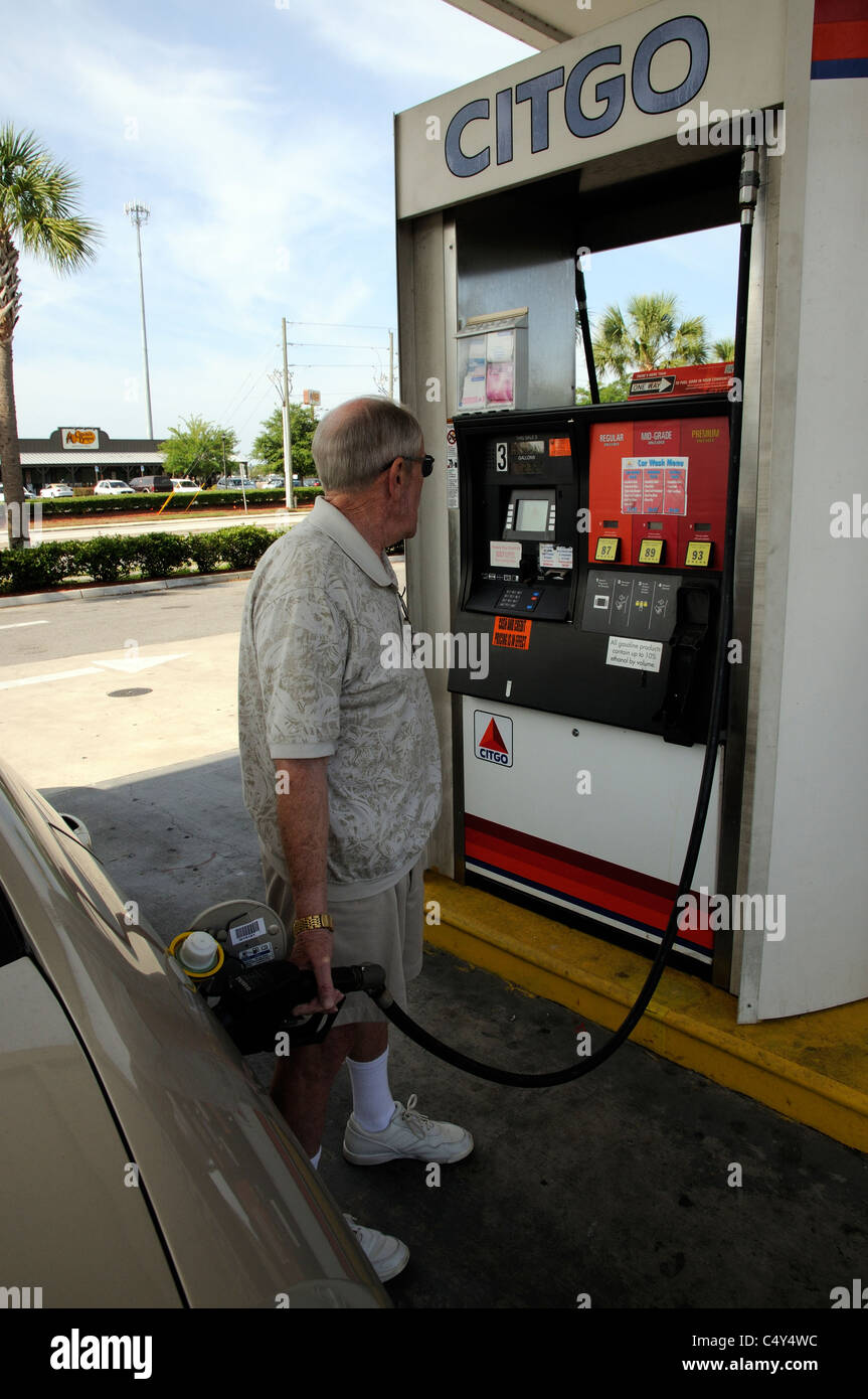 Man filling his car with fuel at a gas station Florida USA Stock Photo