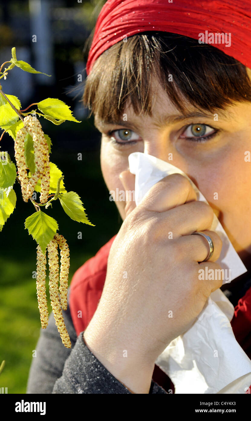 women sniffs behind pollen Stock Photo