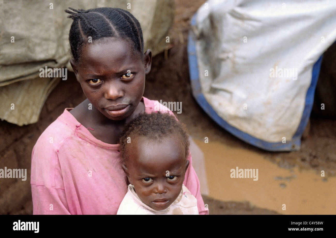 A young women (14years old) with her young child at Lugufu refugee camp, tanzania Stock Photo