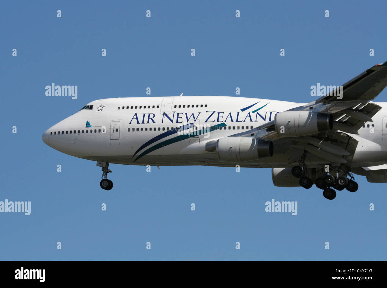 Air New Zealand Boeing 747-400 jet plane flying on approach. Close-up of nose section. Long haul air travel. Stock Photo