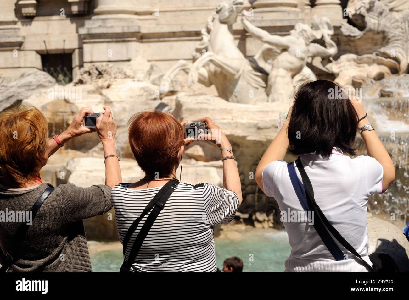 italy, rome, trevi fountain, tourists taking photos Stock Photo