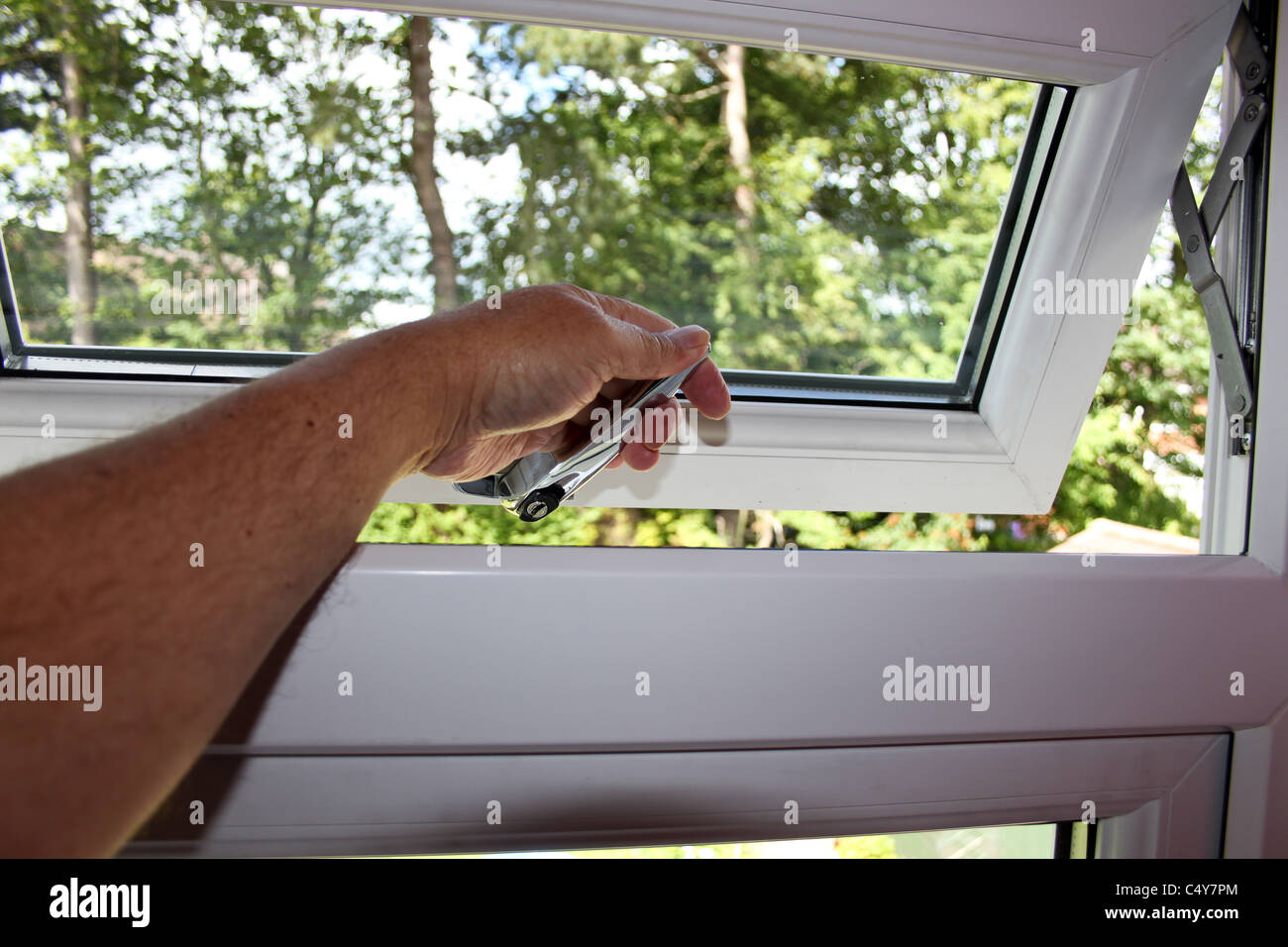 Opening And Closing New Pvc Windows And Doors Stock Photo