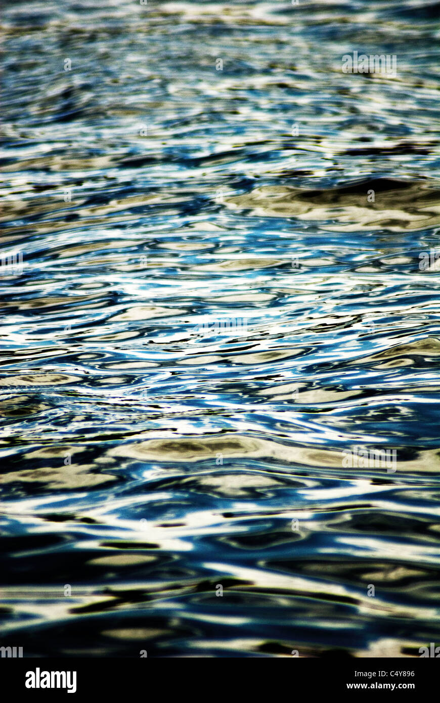 a moody abstract image of the ripples of water on a river Stock Photo