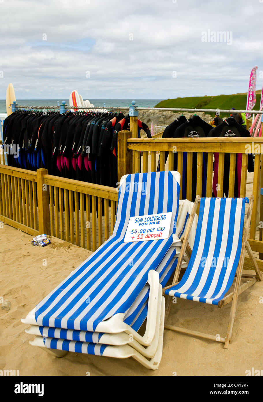 Sun loungers and wetsuits for hire at Fistral Beach in Newquay Stock Photo Alamy