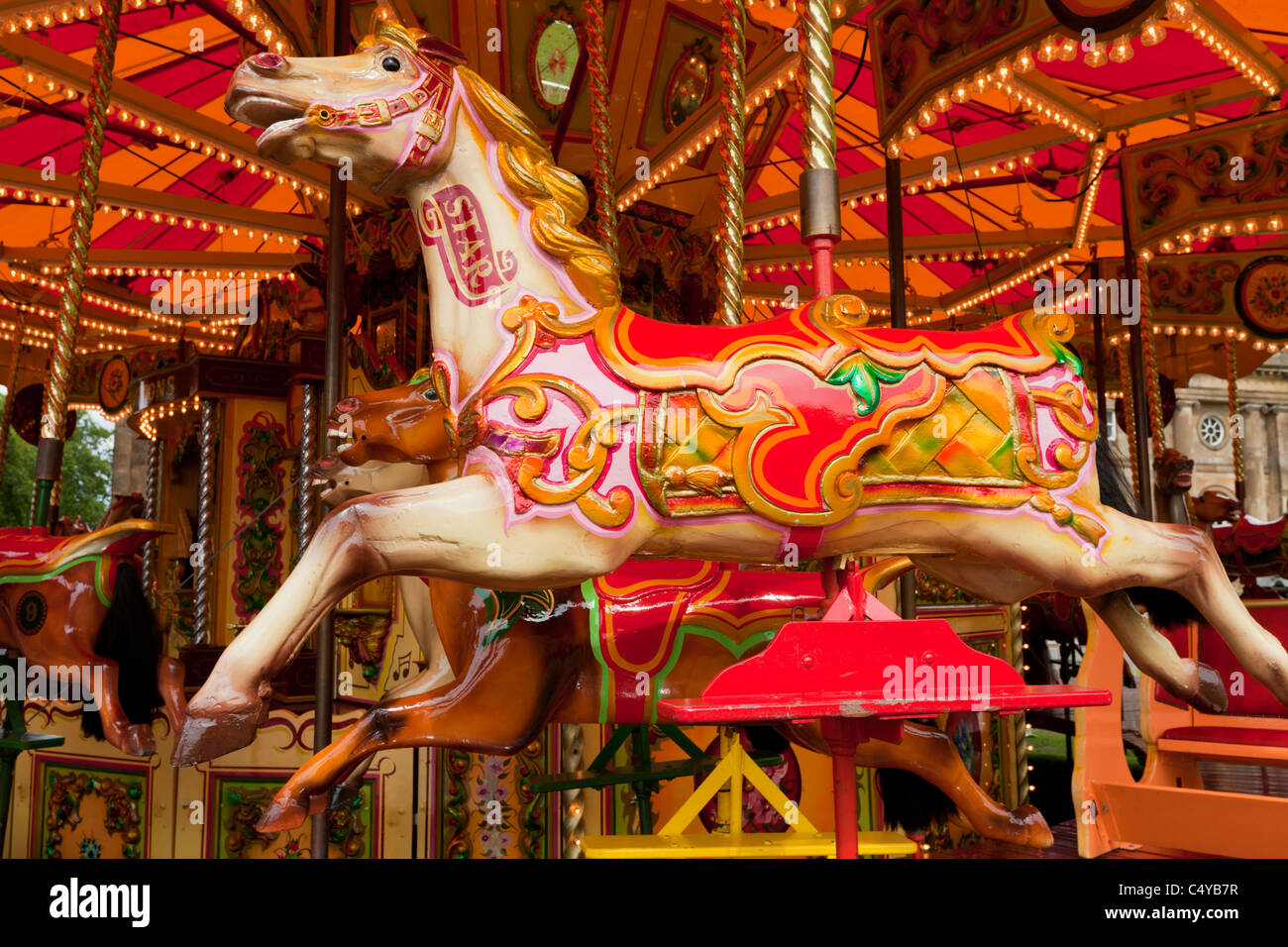 Fairground Horses on a Merry -go-round  funfair ride amusement park  England GB UK EU europe Stock Photo