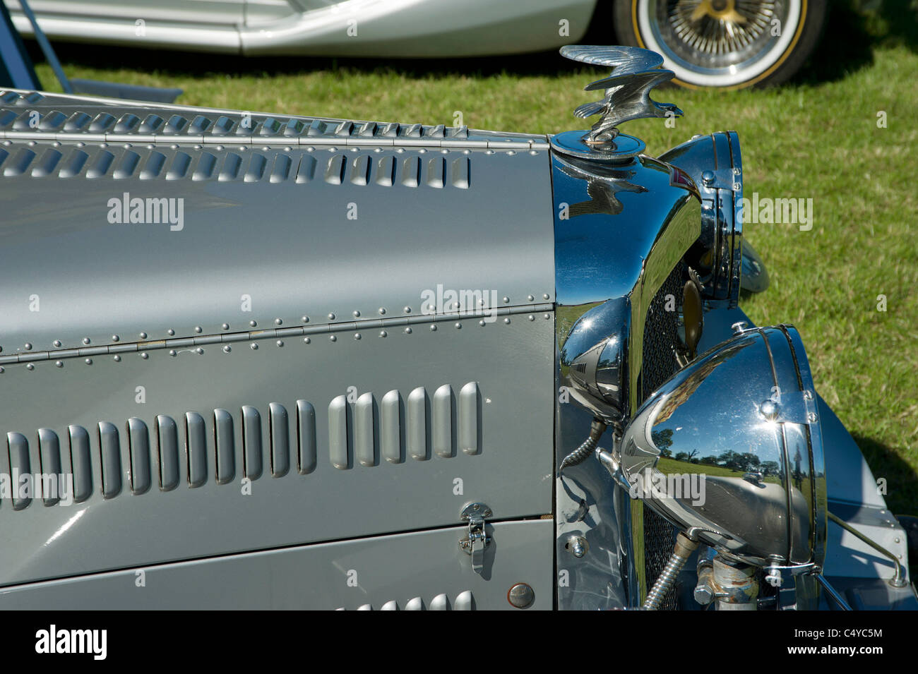 Alvis motor car front head light and hood ornament Stock Photo Alamy
