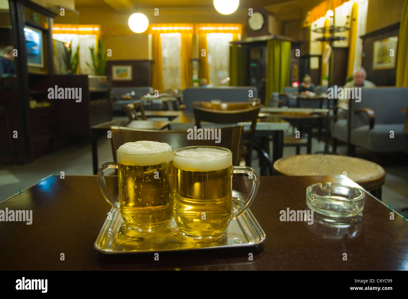 Two half litre glasses of local beer in a typical beerhall in Neubau district Vienna Austria central Europe Stock Photo