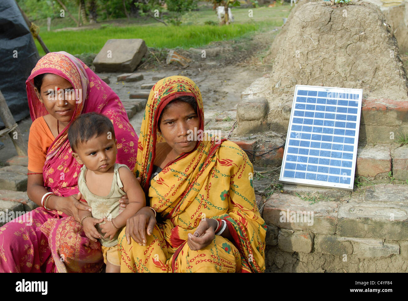 INDIA West Bengal , Sagar Island in Sundarban the delta of Ganga river , family with solar home  system Stock Photo