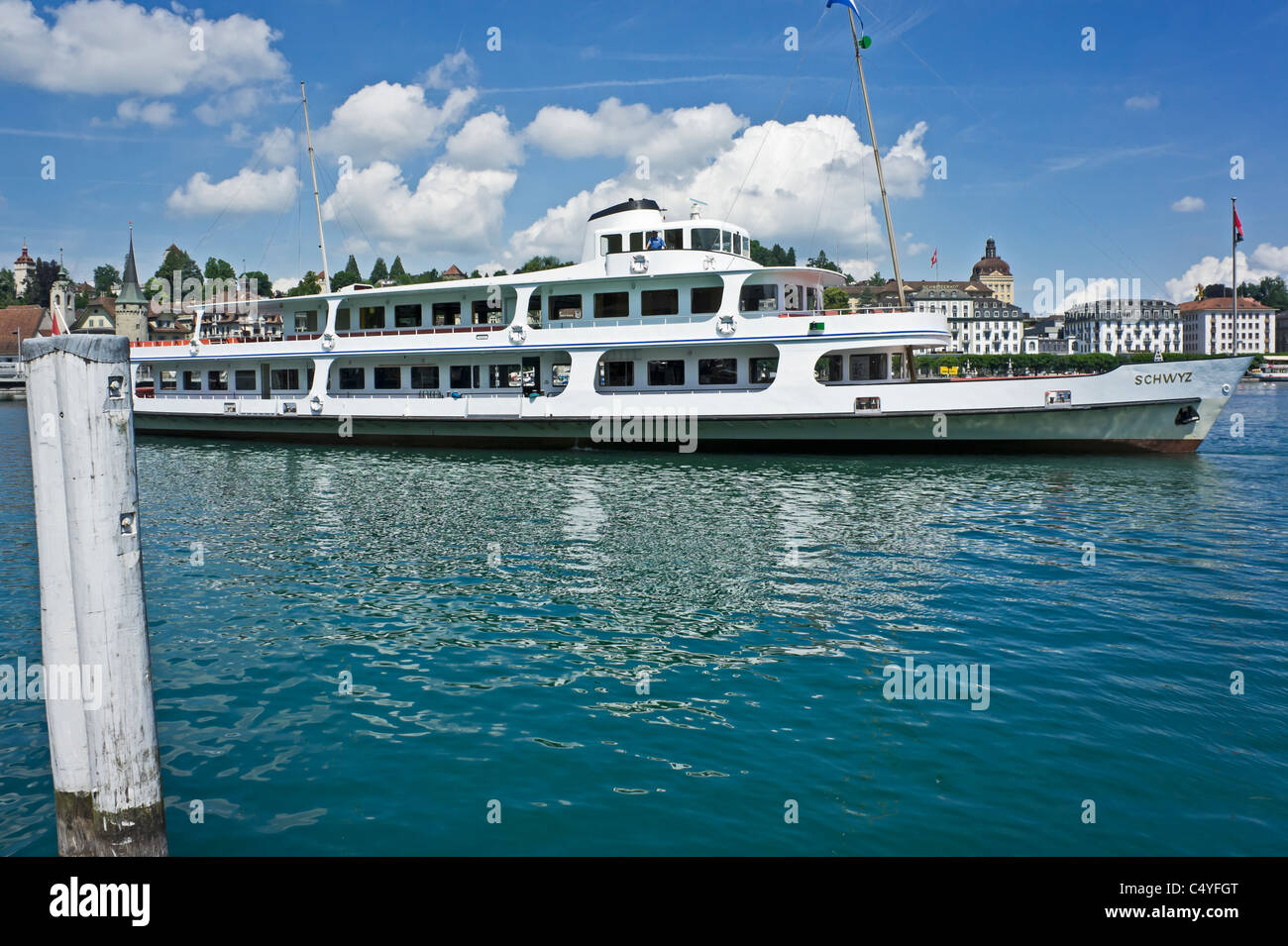 Swiss passenger motor ship Schwyz is reversing towards the pier on Lake Lucerne in Lucerne to take on passengers Stock Photo
