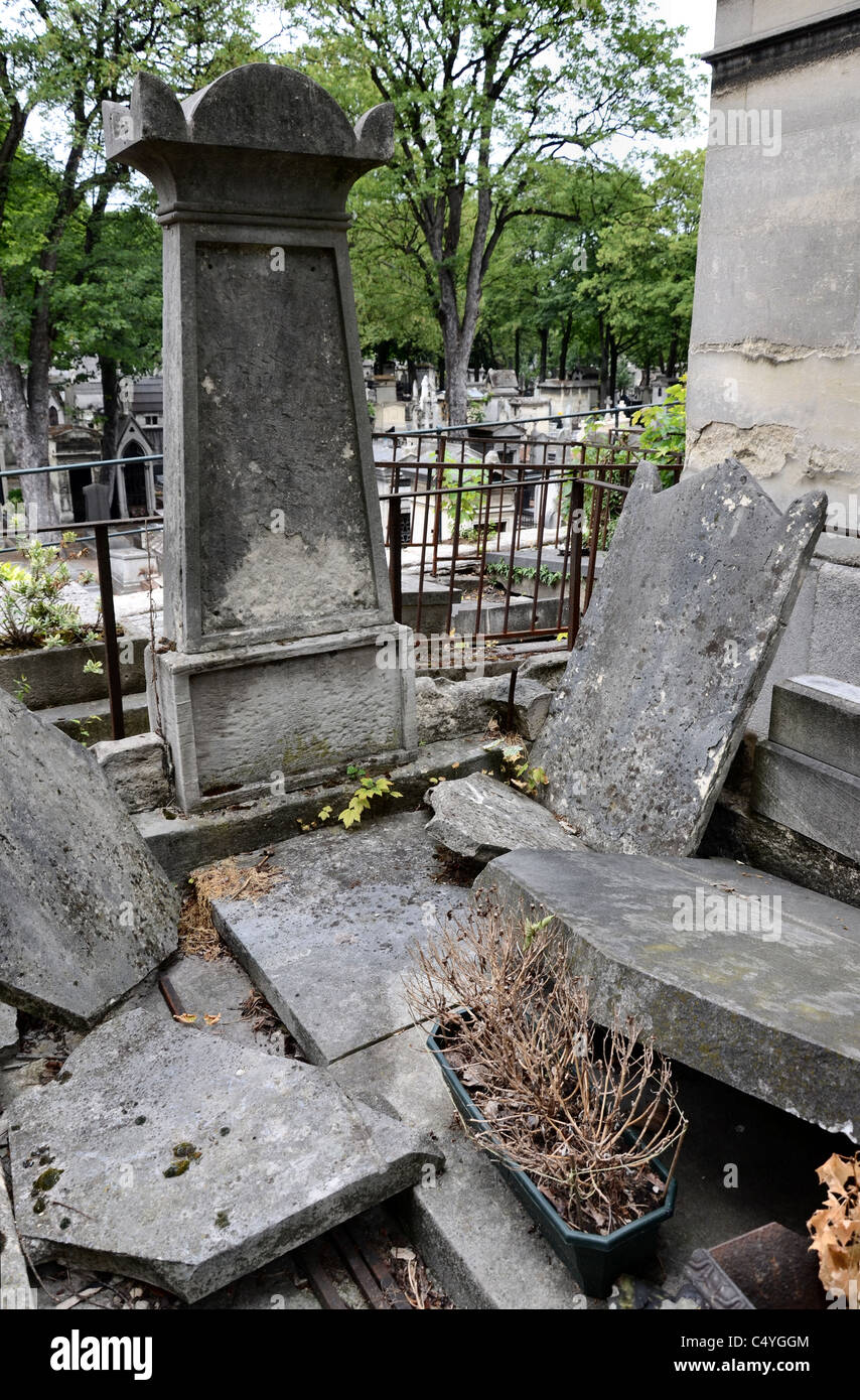 A time ravaged tomb in Montmartre Cemetery, Paris, France. Stock Photo
