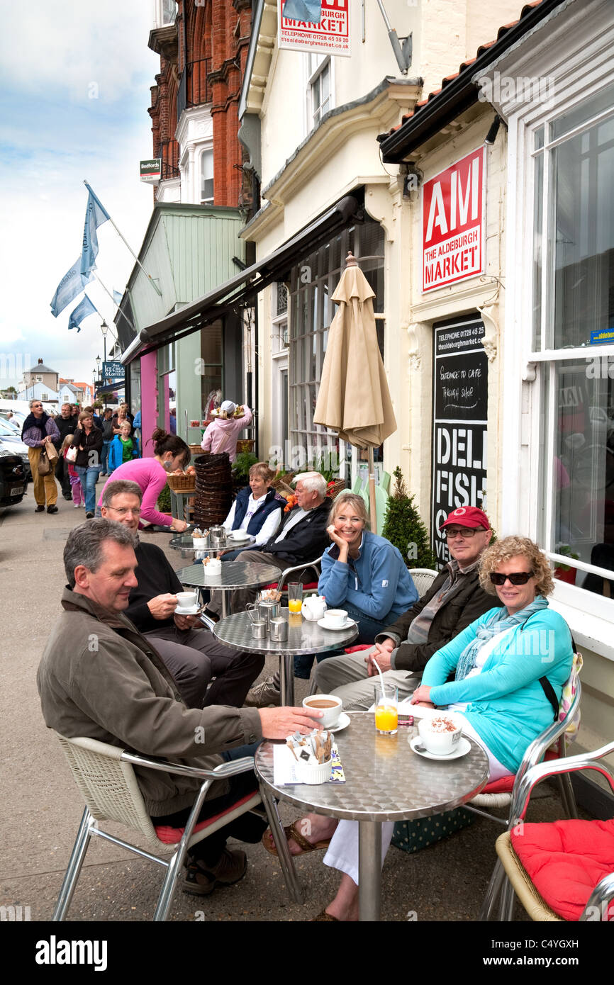 People enjoying a coffee at the Aldeburgh market cafe, High st, Aldeburgh Suffolk UK Stock Photo