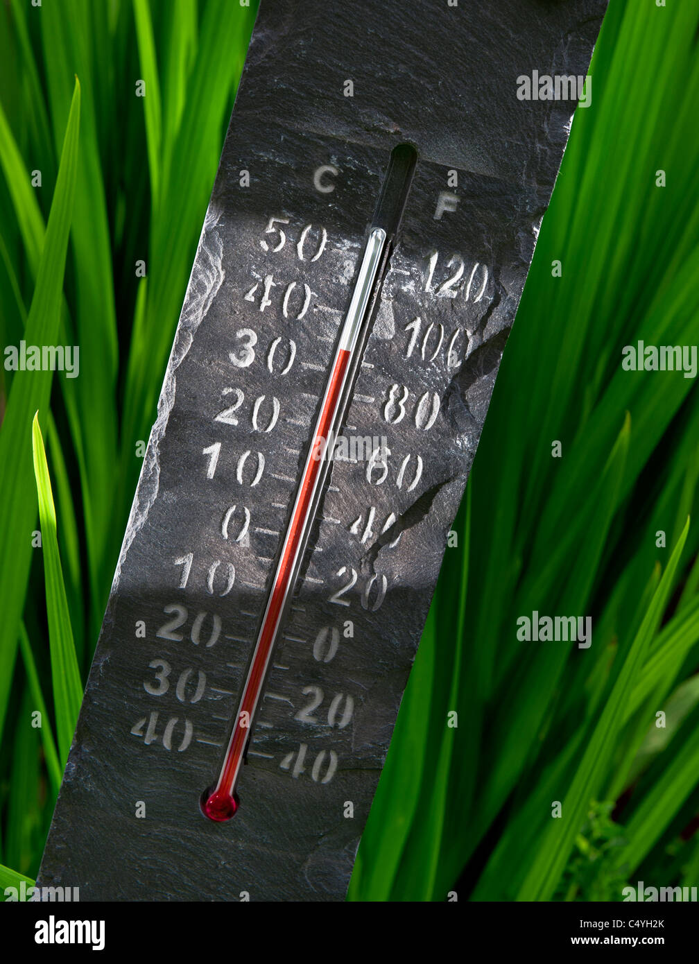 thermometer at 35C 'set in stone' historic temperatures in light shaft Stock Photo