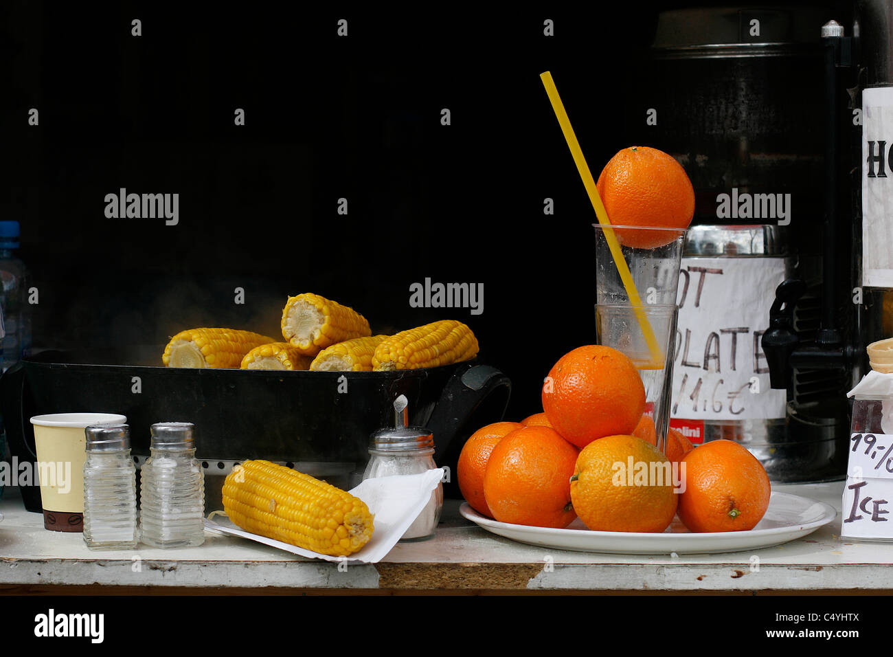 Grilled maize and fresh orange juice sold in a stall in the center of Prague, Czech Republic. Stock Photo