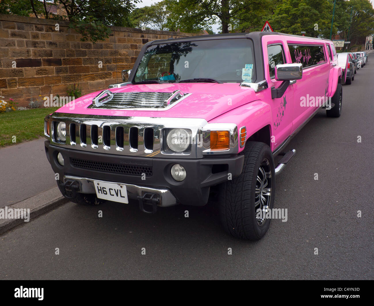 A bright pink Hummer stretched limousine Stock Photo