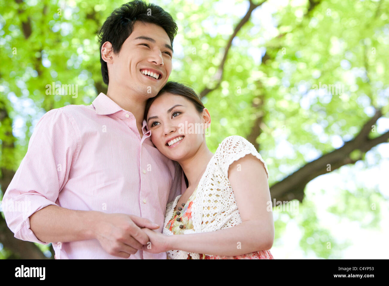Happy Young Couple at the Park Stock Photo - Alamy