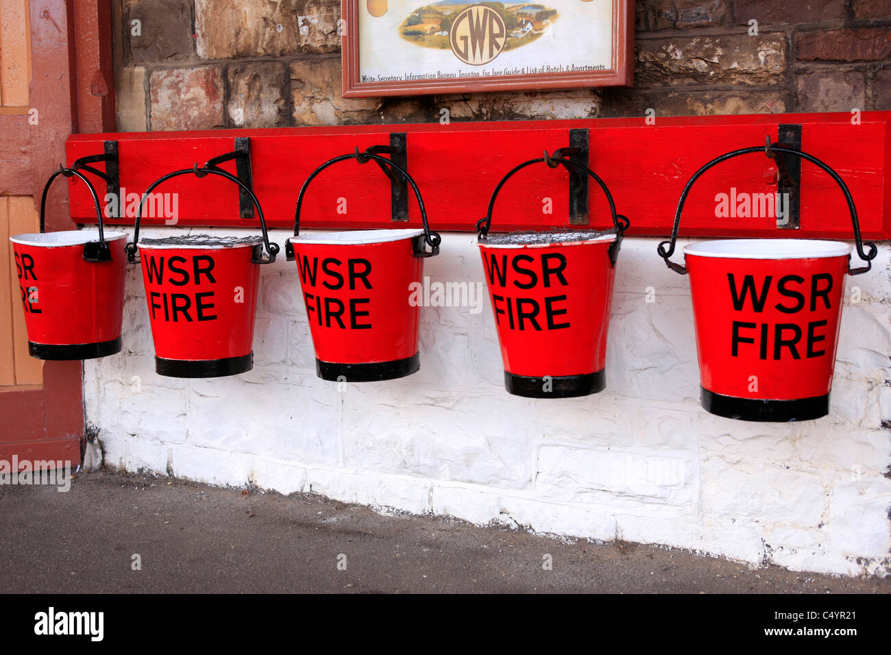 Red Fire buckets hanging up at Mineheads WSR station Stock Photo