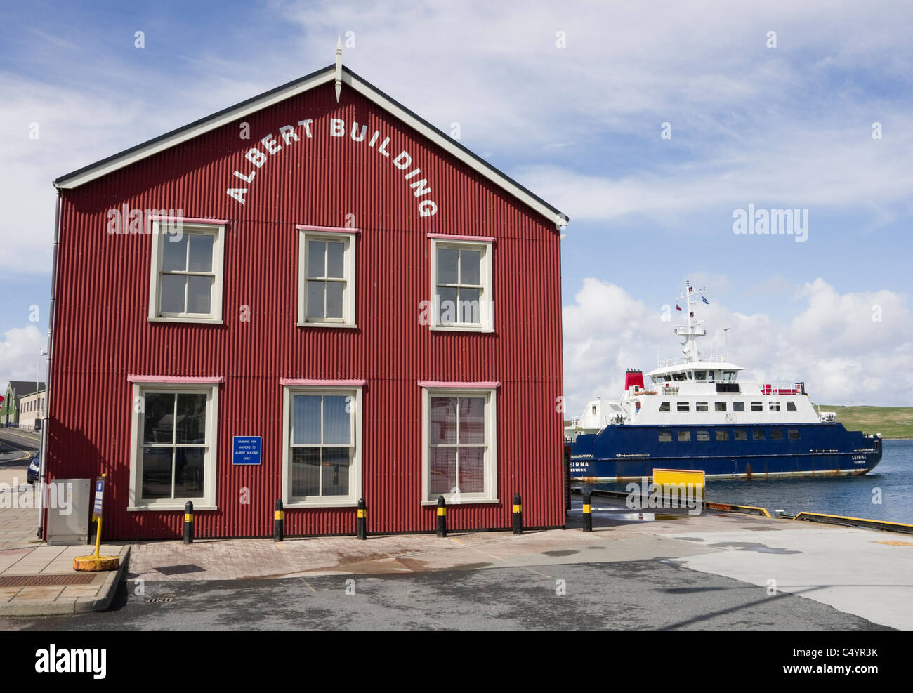 The Albert Building Port Authority offices on the dockside with Bressay ferry beyond. Lerwick, Shetland Islands, Scotland, UK. Stock Photo