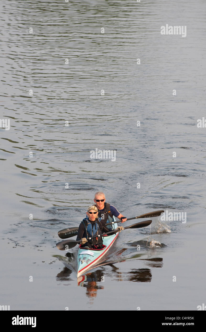 Early morning, canoeists on the River Thames at Teddington during the annual Devizes to Westminster International Canoe Race Stock Photo