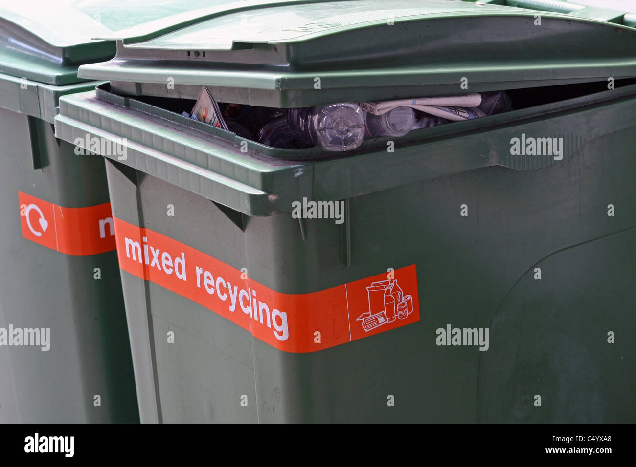 Two wheelie bins full of rubbish Stock Photo Alamy