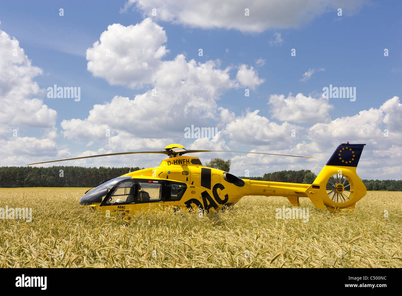 German ADAC Rescue Helicopter in a corn Field Stock Photo