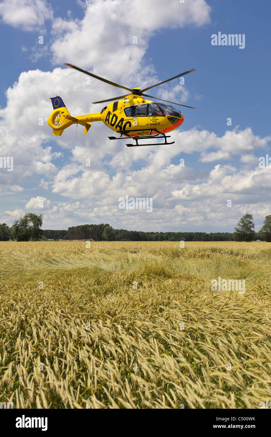 German ADAC Rescue Helicopter in a corn Field Stock Photo