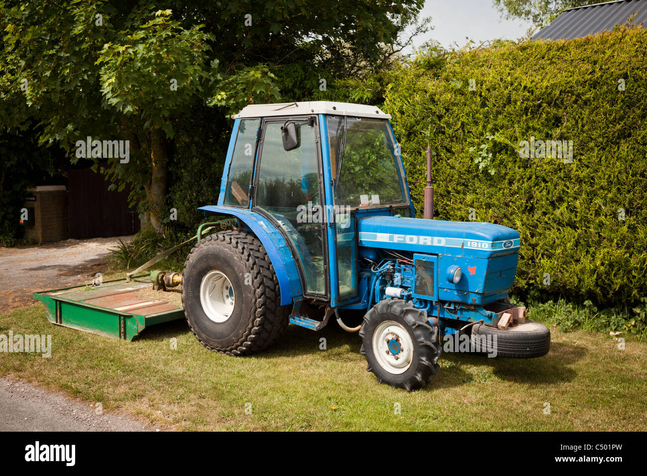 Ford 1910 compact vintage tractor with grass cutting attachment Stock Photo