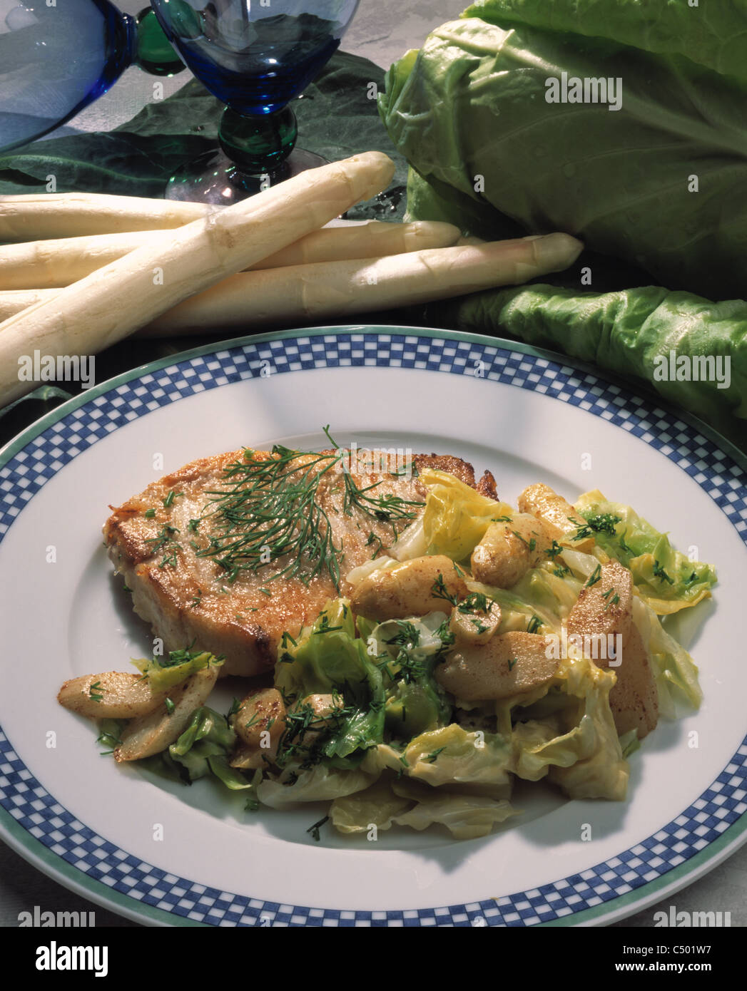 Pointed cabbage - asparagus - vegetables with fried fillet of redfish Stock Photo