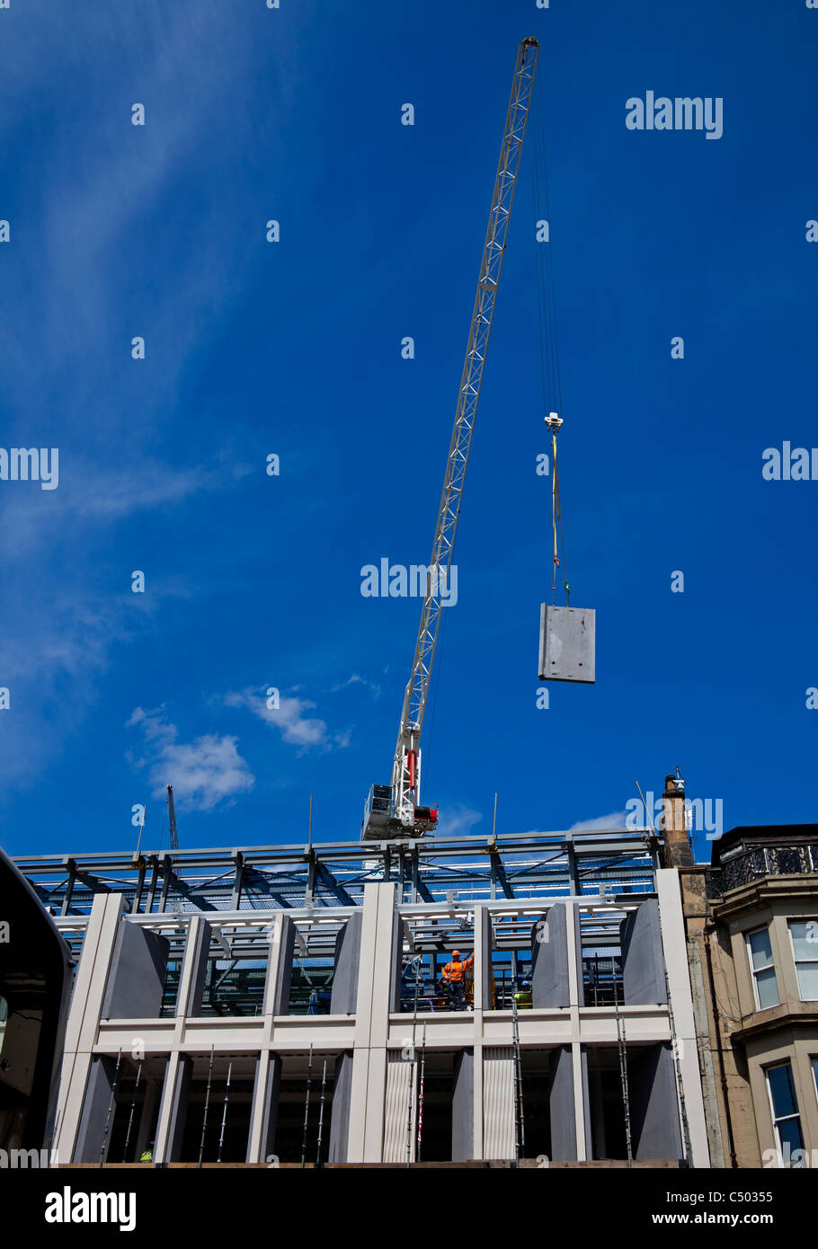 Construction Edinburgh, crane lifts stone panel Stock Photo